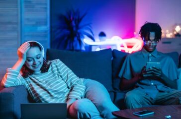 couple-home-together-couch-using-modern-devices_23-2148793523