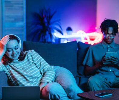 couple-home-together-couch-using-modern-devices_23-2148793523