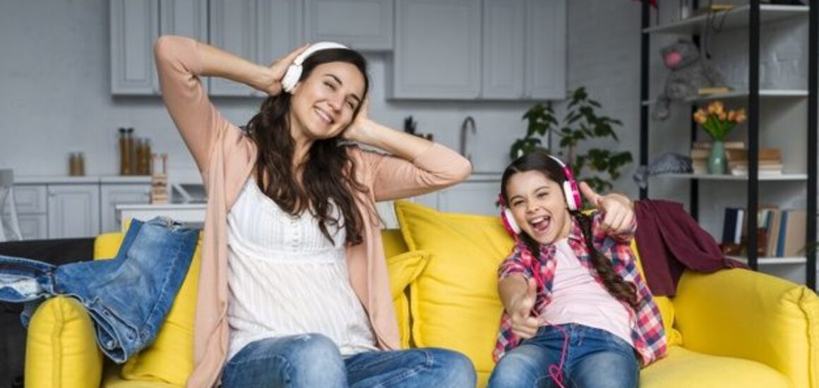 Free Photo _ Mother and daughter listening to music and having fun