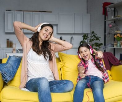 Free Photo _ Mother and daughter listening to music and having fun