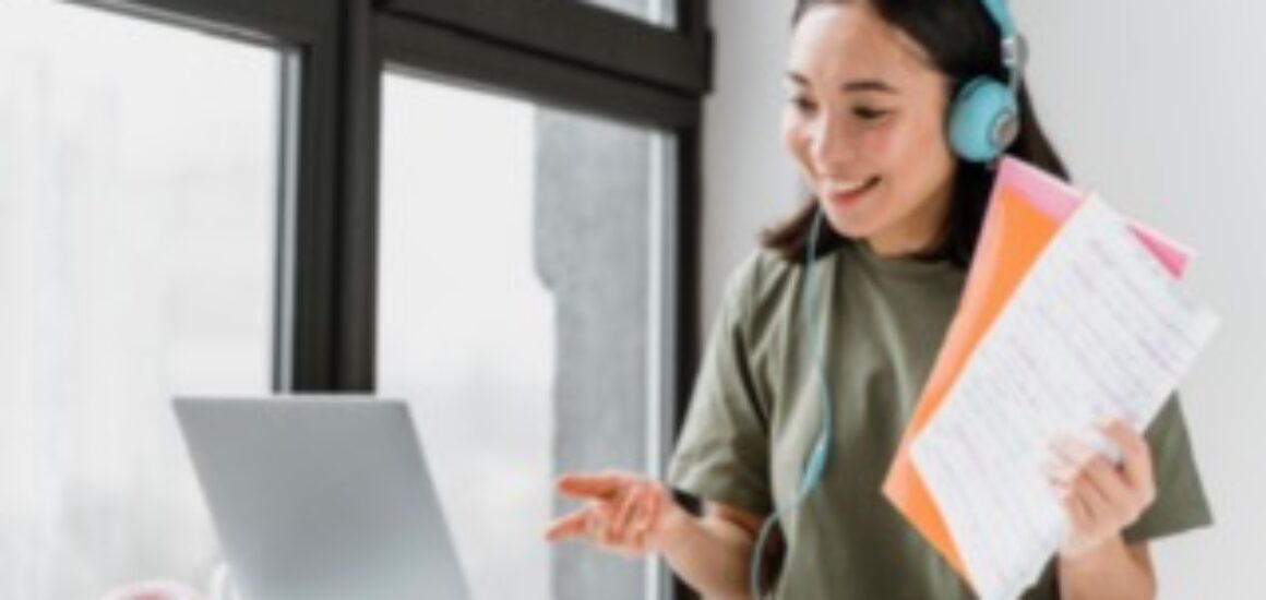 woman-with-headphones-having-video-call-laptop
