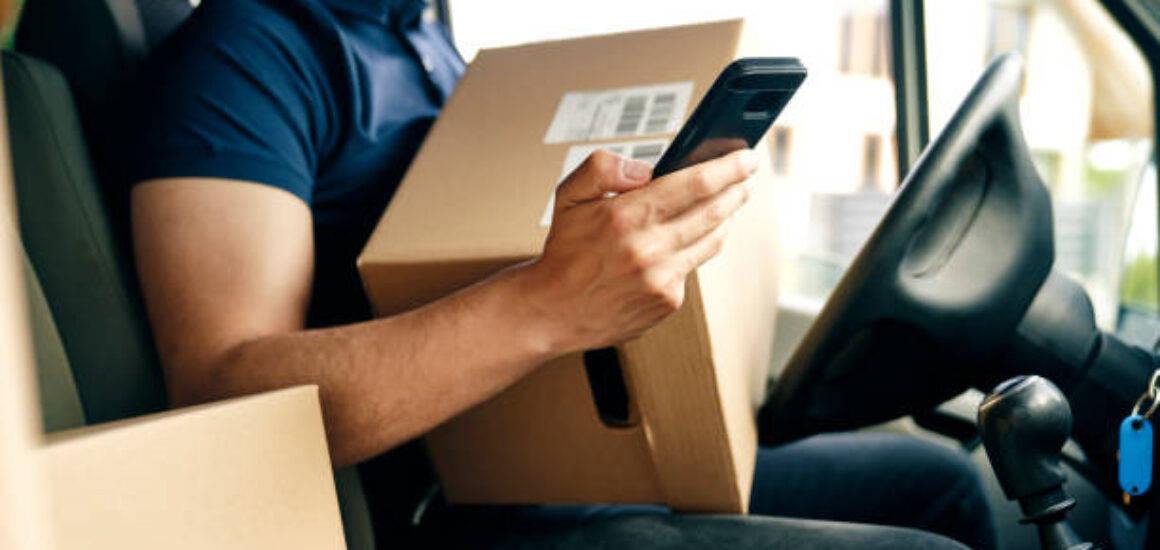 Close up of checking a package using portable information device