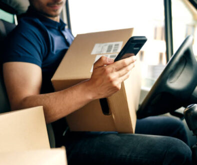 Close up of checking a package using portable information device
