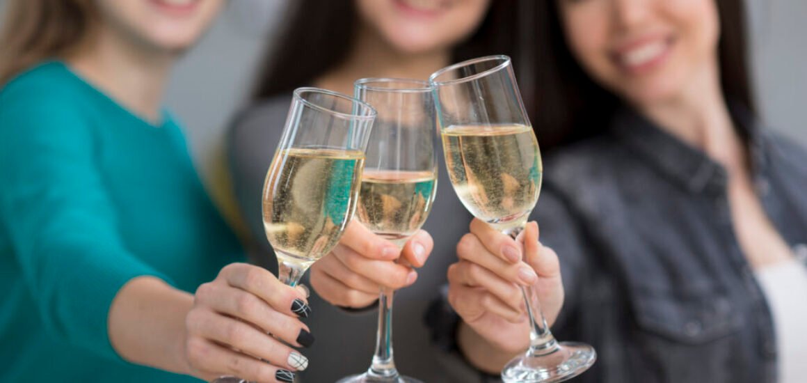 close-up-cute-young-women-having-champagne-together